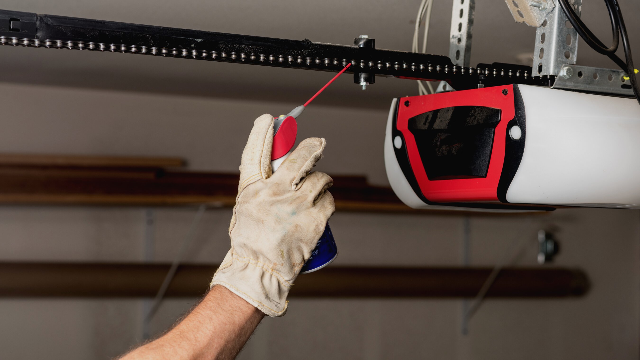 Applying oil to a chain of a garage door opener